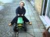 Kid on a traktor pulled by dog, for a laugh