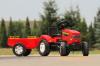 Czerwony traktor na peda y Farm Mustang przyczepa 1060B